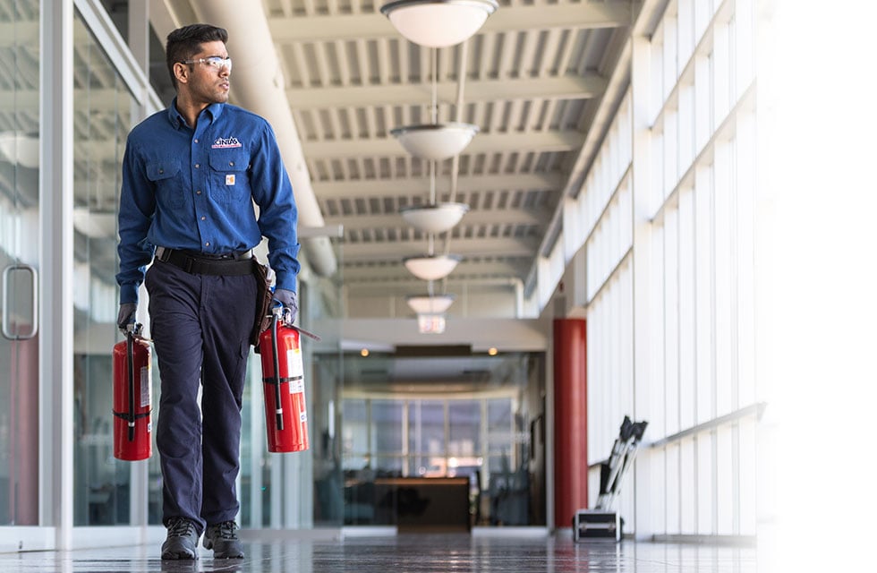 cintas fire service representative with fire extinguishers