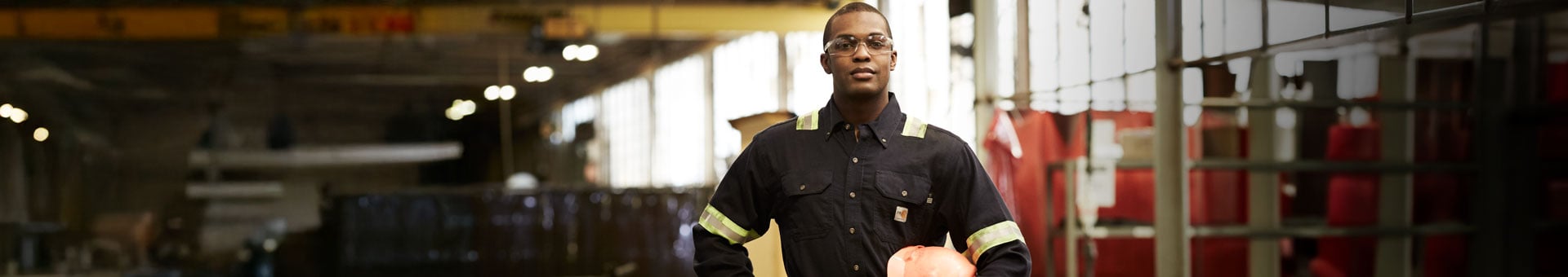 Man in manufacturing plant wearing PPE | Cintas