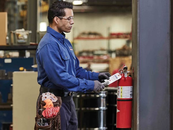 CintasFireProtectionRepresentativeinspectingfireextinguisher