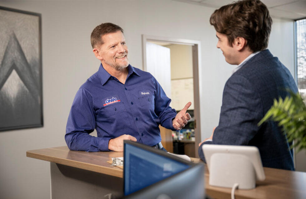 Cintas representative conversing with customer