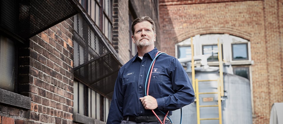 Worker wearing Cintas ComfortFlex Pro Work Shirt